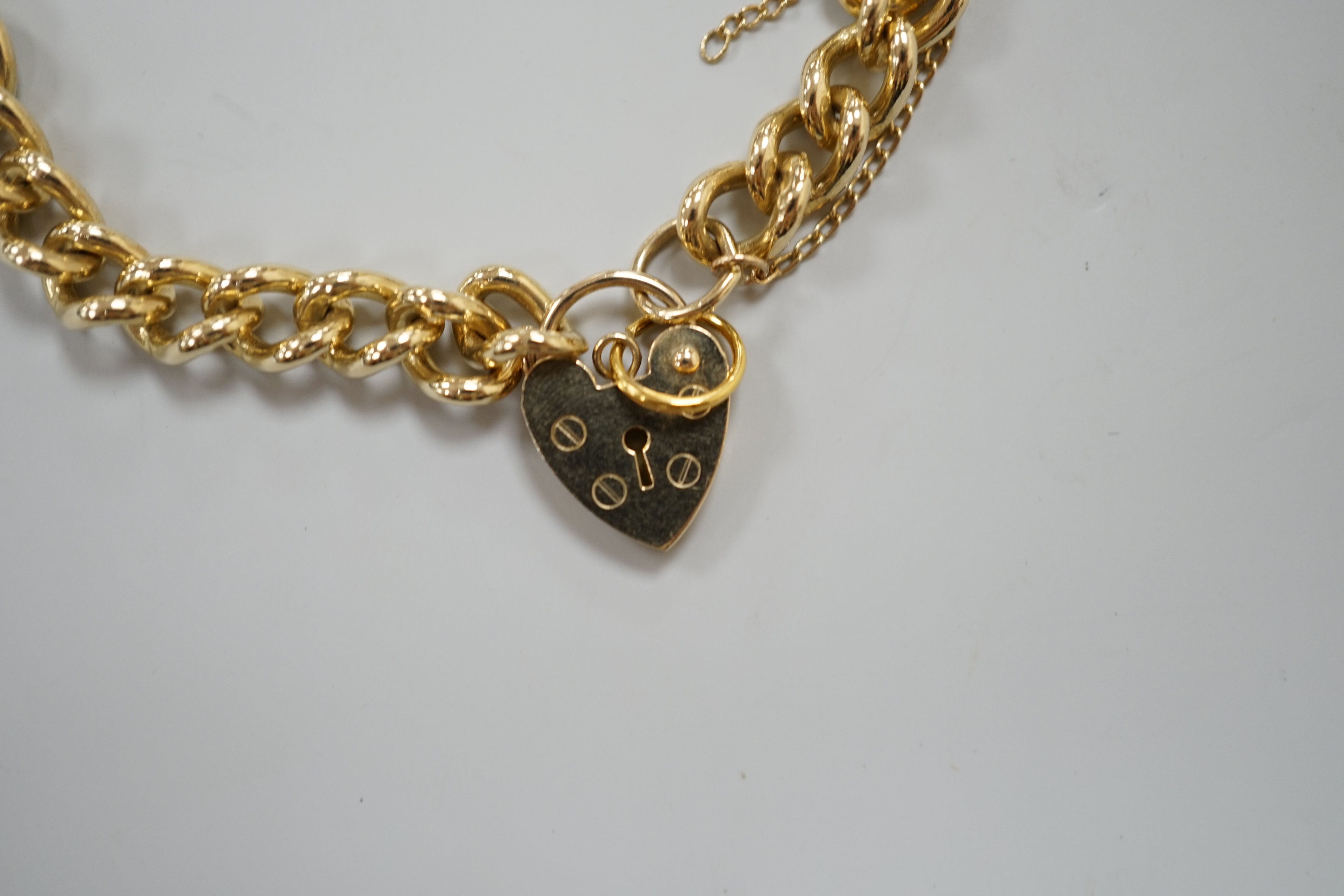 A 9ct gold curblink bracelet, with padlock clasp, 16.4 grams